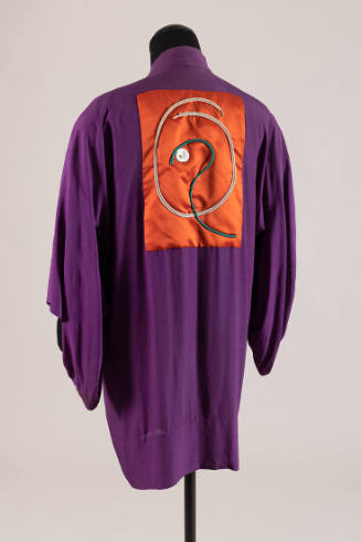 Back view of purple kimono with red back patch with pink, white and green braid design