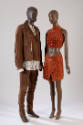 Man’s brown suede motorcycle jacket ensemble on left and women’s orange/brown suede set of halt…