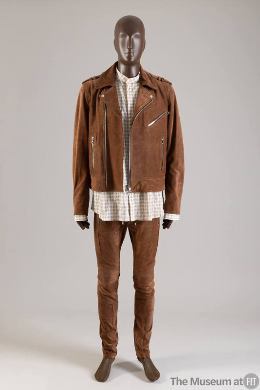Man’s ensemble of brown suede zip front motorcycle jacket, matching slim pants and brown and wh…