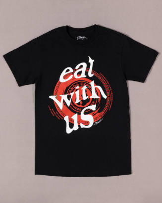 Black short sleeve t-shirt with white text “Eat With Us” superimposed over red Panda Express de…