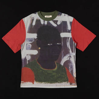 T-shirt with green collar, red short sleeves and print of a painted portrait of a man wearing a…