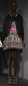 Black bomber jacket over flared mini dress with black bodice and skirt in beige, black and red …