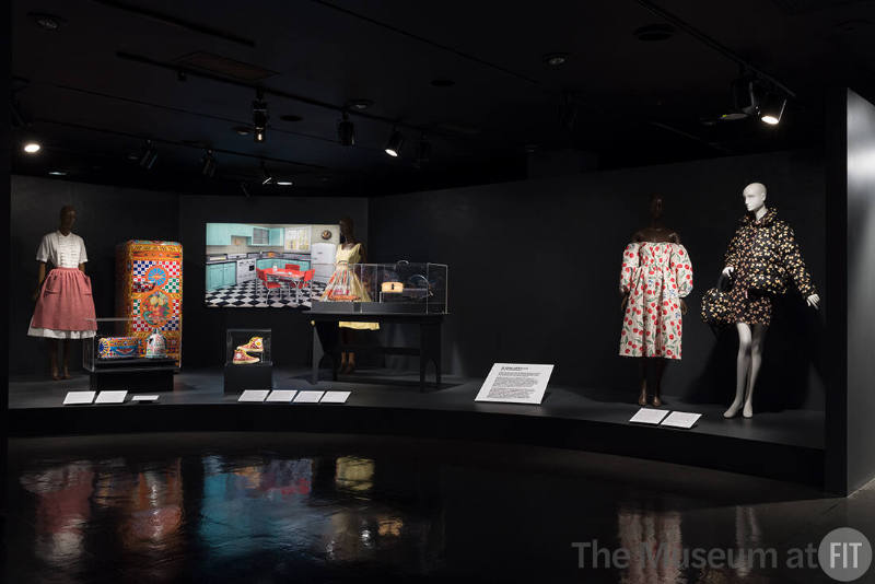 Food & Fashion exhibition installation view of four dressed mannequins, accessories in four cas…