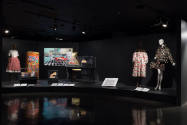 Food & Fashion exhibition installation view of four dressed mannequins, accessories in four cas…
