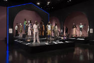 Food & Fashion exhibition installation view of the gallery with dressed mannequins and cases of…