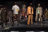 Food & Fashion exhibition installation view of the gallery with dressed mannequins on multiple …