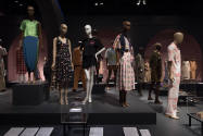 Food & Fashion exhibition installation view of the gallery with dressed mannequins on multiple …