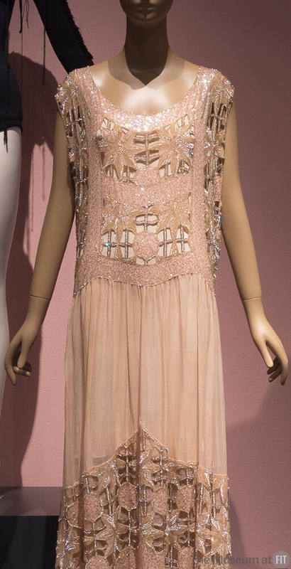 Pink sleeveless evening dress with sequin and crystal bead embroidery and cut out floral patter…