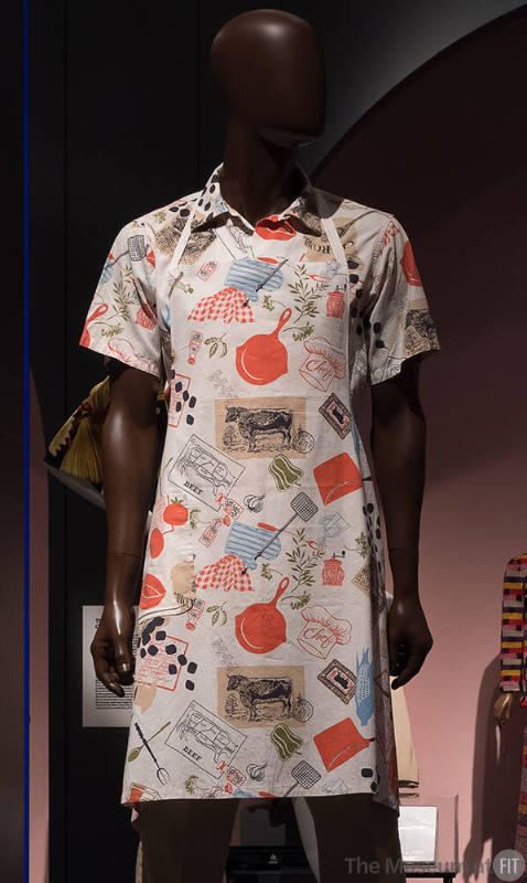 Man’s white apron and matching short sleeve shirt with orange, blue, beige, green and black pri…