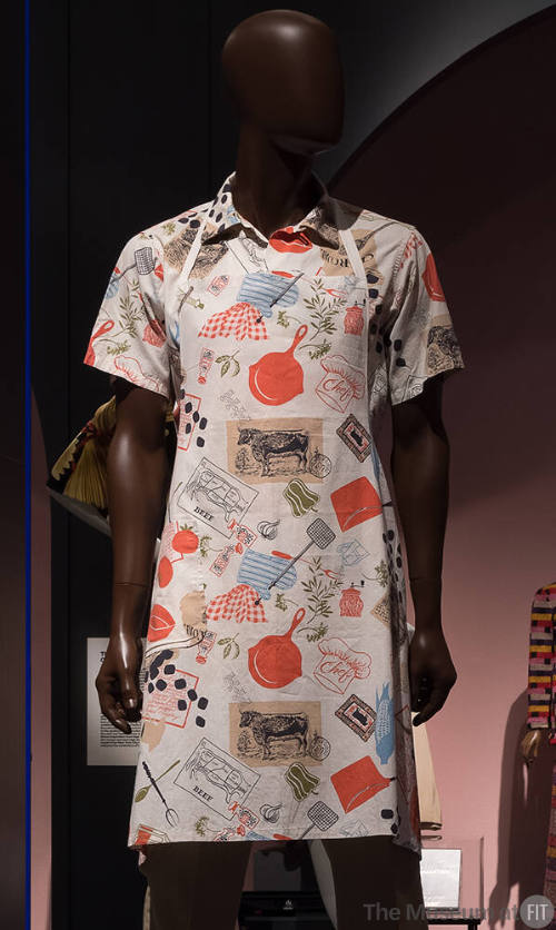 Man’s white apron and matching short sleeve shirt with orange, blue, beige, green and black pri…
