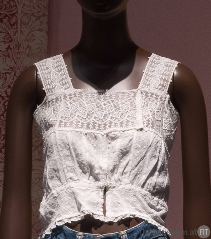 White embroidered camisole top with lace band shoulder straps and upper bodice, cropped length …