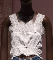 White embroidered camisole top with lace band shoulder straps and upper bodice, cropped length …