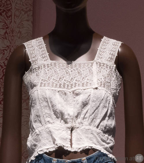 White embroidered camisole top with lace band shoulder straps and upper bodice, cropped length …