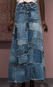 Blue denim patchwork flared maxi skirt embroidered with red and orange cross-stitch