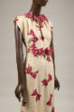 Ivory evening dress, printed with red bows and matching belt