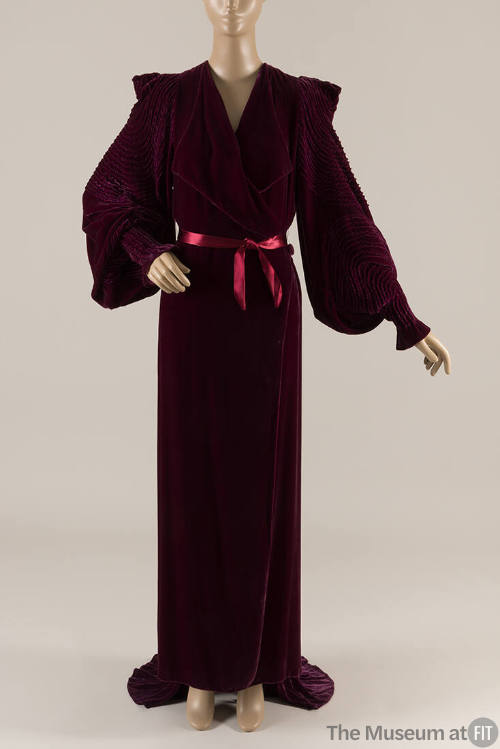 Dark red velvet long sleeve floor length robe with train, wide lapels and silk ribbon waist tie