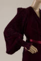 Detail of dark red velvet robe long pintucked sleeve and shoulder and silk ribbon waist tie