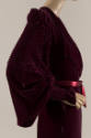 Side detail of dark red velvet robe long pintucked sleeve and cuff and silk ribbon waist tie