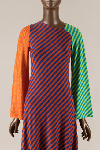Long sleeve dress with striped color blocked sections of green and blue right arm, yellow and o…