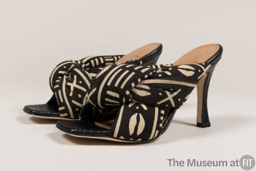 Pair of brown and beige Burkina Faso cotton batik high heel mule sandals with padded criss-cros…