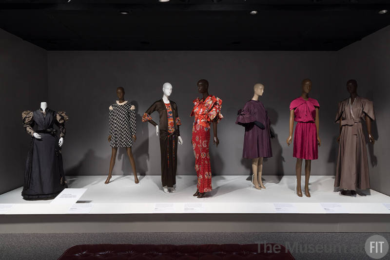 Puffs and Folds. From left to right: dinner dress by Ranhn, c.1894 (P84.22.47); dress by Rudi Gernreich, fall 1968 (94.105.1); dress by Milgrim, 1924 (74.72.12); dress by Christian Dior Boutique, fall 2003 (2022.65.6); evening coat by Christian Dior, 1953 (71.267.3); dress by Lanvin, spring 2009 (2018.59.1); dress by Isabel Toledo, spring 2002 (2010.1.48).