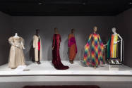 Statement Sleeves exhibition installation view of six dressed mannequins in the Sheer and Split…