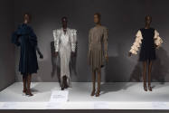 Statement Sleeves exhibition installation view of four dressed mannequins in the Tucks and Ruff…