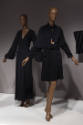 Statement Sleeves exhibition installation view of two mannequins in black dresses in the Fundam…