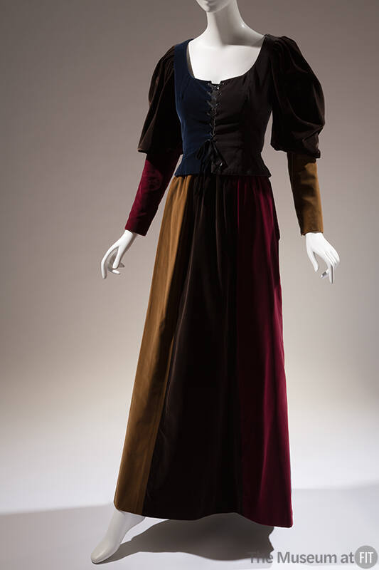 Floor length evening dress of pieced velveteen in blue, grey, red, yellow and brown with laced …