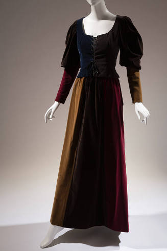 Floor length evening dress of pieced velveteen in blue, grey, red, yellow and brown with laced …