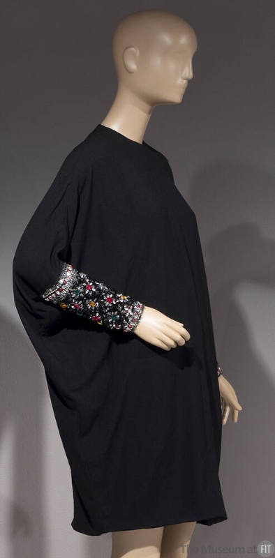 Black long sleeved cocktail dress with long jeweled cuffs