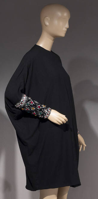 Black long sleeved cocktail dress with long jeweled cuffs