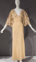 Ivory gown, v neck with floral net inserts on bodice and elbow length sleeves