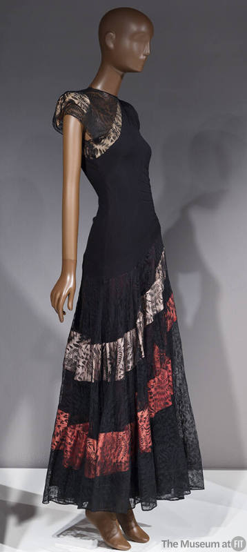 Black gown, asymmetrical drop waist, lace skirt with blue and pink diagonal bands