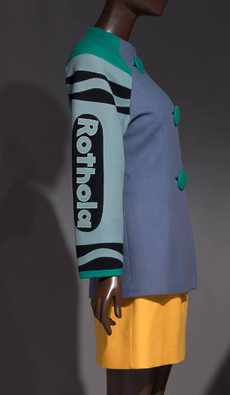 3/4 view of blue long sleeve jacket with green Rothola crayon sleeve, trim and buttons, yellow …