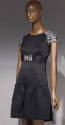 Black above-the-knee dress with rhinestone encrusted cap sleeves, belt with rhinestone buckle, …