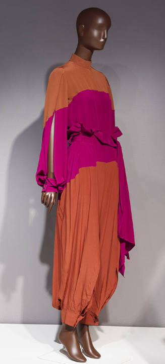 Dark orange blouse with open sleeve and matching loose pants gathered at ankle with pink colorb…