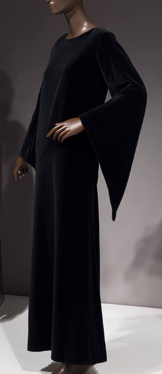 Black velvet floor length evening gown with long bell sleeves