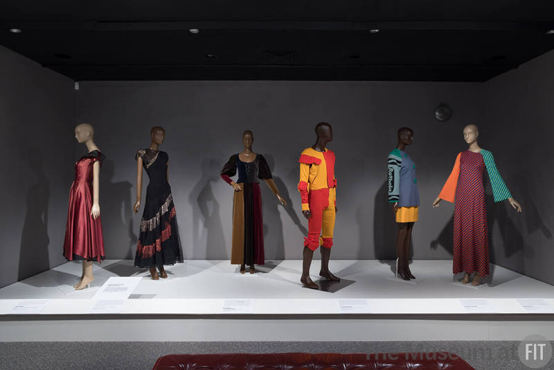 From left to right: dress by Robert Piguet, 1949 (78.125.25); black dress, c.1940 (83.15.1); dress by Yves Saint Laurent Rive Gauche, 1970 (76.201.2); man's ensemble by Vivienne Westwood, spring 1989 (P89.60.2); suit by Christian Francis Roth, fall 1990 (2020.40.1); dress by Stephen Burrows, c.1973 (2016.32.4)
