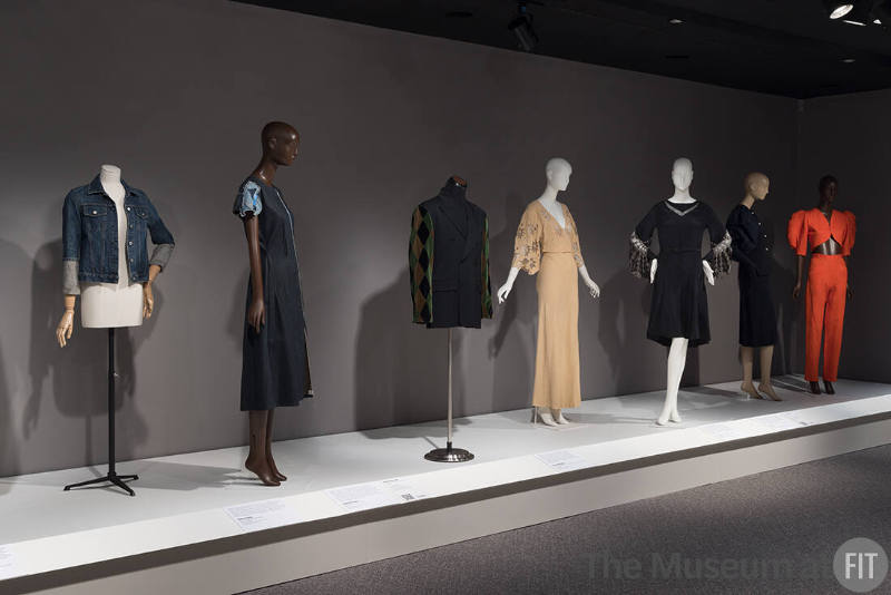 From left to right: jacket by Helmut Lang, c.1999 (2023.27.3); dress by Susan Cianciolo, 2006 (2015.41.2); man's jacket by Jean Paul Gaultier, fall 1988 (P88.76.6); pink evening gown, c.1932 (81.159.1); black dress, c.1927 (81.159.2); cocktail suit by Adrian, c.1950 (71.220.1); set by Yves Saint Laurent Rive Gauche, summer 1992 (2022.65.24)