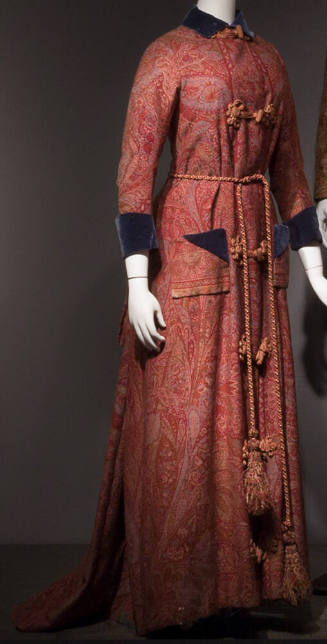 Floor length red paisley dressing gown with frog closures, blue velvet trim at neck and wrists …