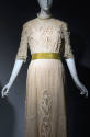 White sheer floor length dress embroidered and inset with lace, short stand collar, elbow lengt…