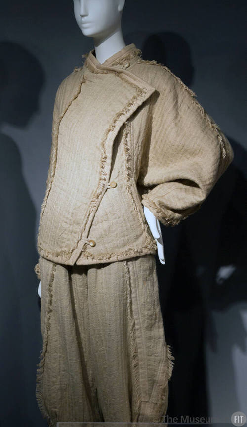 Tan jacket with asymmetrical front panel, two button closing and matching knickers, self fringe…