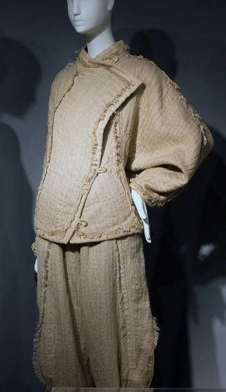 Tan jacket with asymmetrical front panel, two button closing and matching knickers, self fringe…