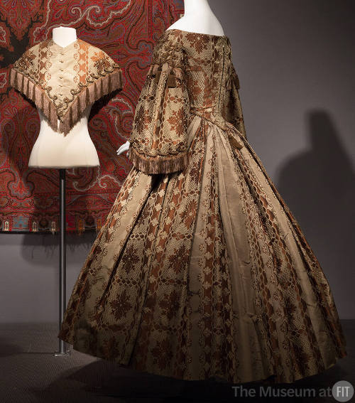 Olive green and brown brocade dress in floral/snowflake pattern with wide floor length skirt, ¾…