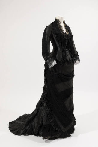 Black two-piece dress, long sleeves, black bead trim on bodice, lace trim on collar and sleeves…
