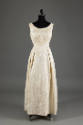 Off-white floral brocade dress, floor length, sleeveless, round neckline, princess seams defini…