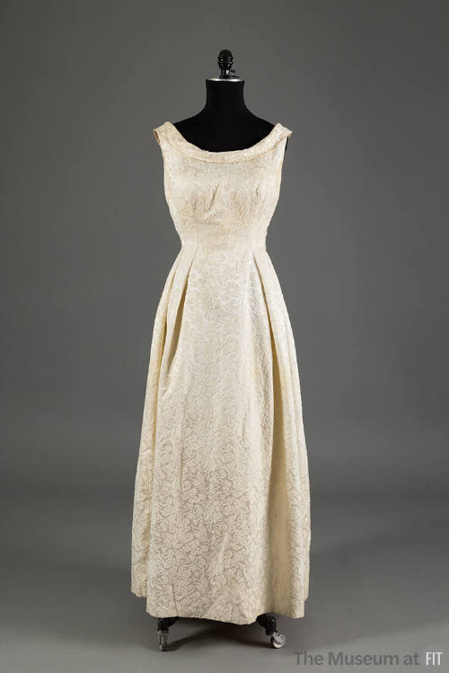 Off-white floral brocade dress, floor length, sleeveless, round neckline, princess seams defini…