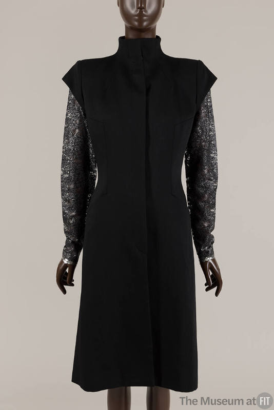 Knee length black coat with cap sleeves and long silver lace sleeves underneath