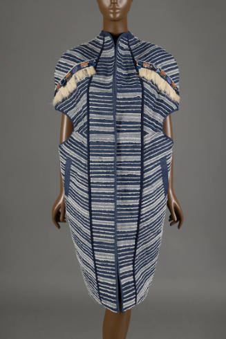 Knee length blue and white striped jacket, cocoon shaped with circular insets on both sides of …